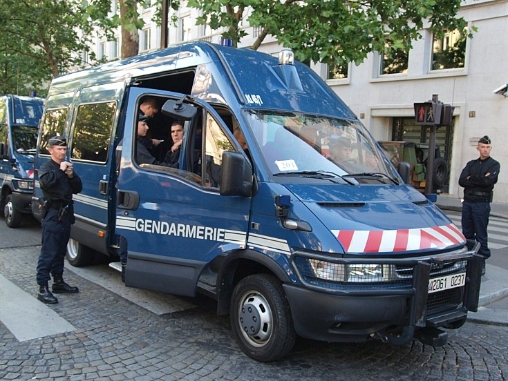 Gendarmerie entering vehicle